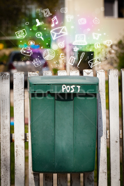 Colorful icons and symbols bursting out of a mailbox Stock photo © ra2studio