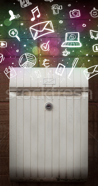 Colorful icons and symbols bursting out of a mailbox Stock photo © ra2studio