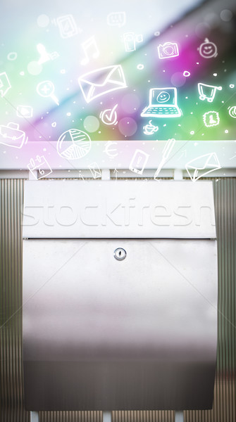 Colorful icons and symbols bursting out of a mailbox Stock photo © ra2studio