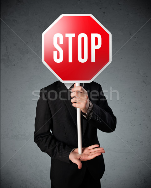 Stock photo: Businessman holding a stop sign
