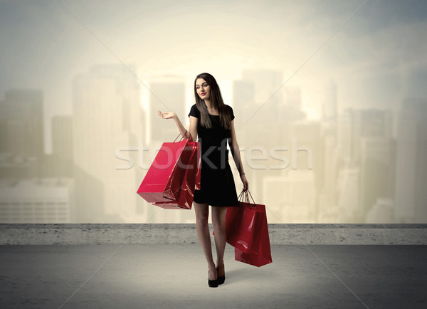 City woman standing with shopping bags Stock photo © ra2studio