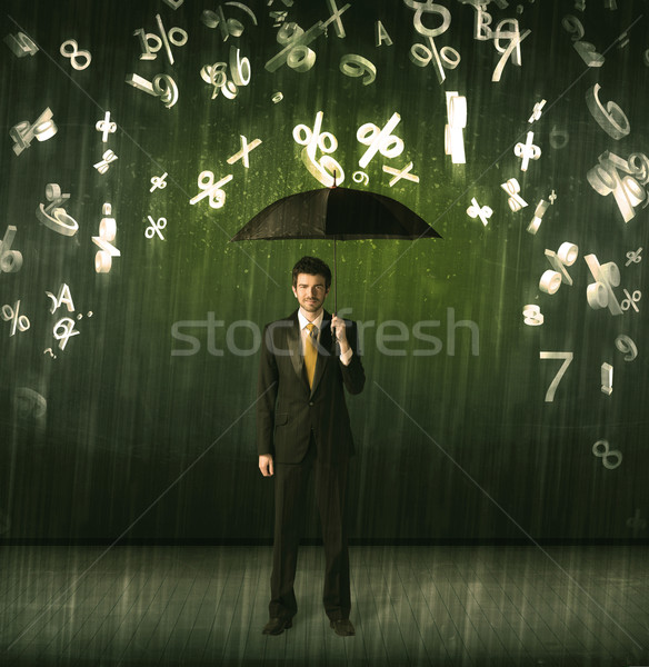 Businessman standing with umbrella and 3d numbers raining concep Stock photo © ra2studio