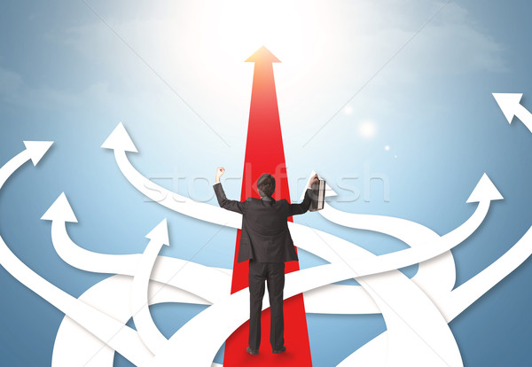businessman with different direction arrows Stock photo © ra2studio