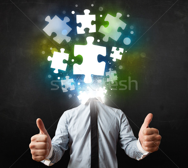 Character in suit with puzzle head concept Stock photo © ra2studio