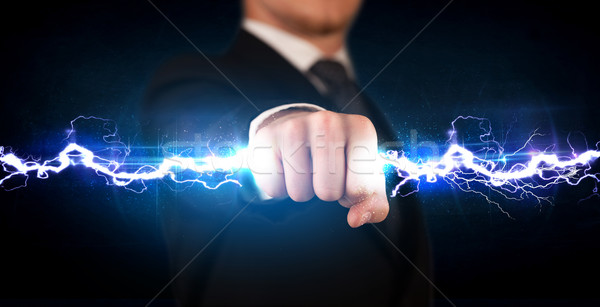 Homme d'affaires électricité lumière mains [[stock_photo]] © ra2studio