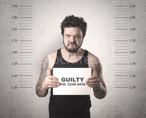 Caught gangster in jail Stock photo © ra2studio