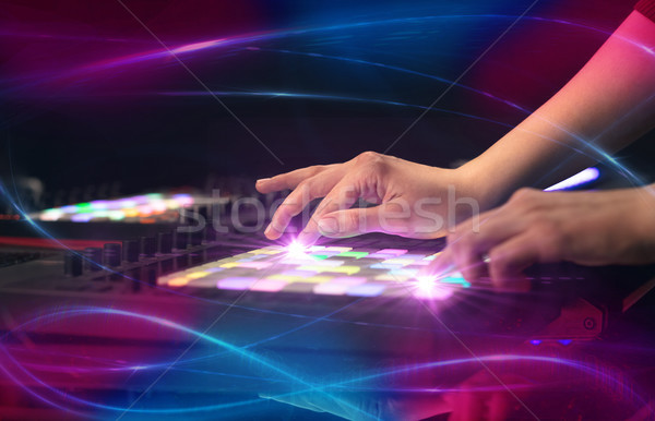 Hand mixing music on midi controller with wave vibe concept Stock photo © ra2studio