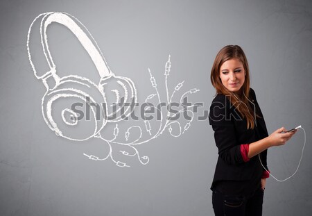 young woman singing and listening to music with abstract headphone Stock photo © ra2studio