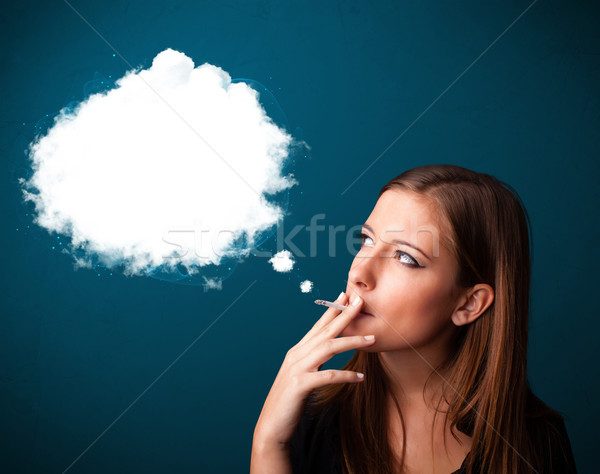 Young woman smoking unhealthy cigarette with dense smoke Stock photo © ra2studio