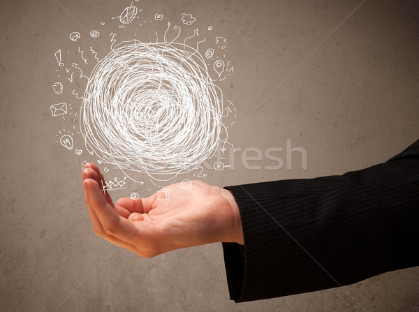 Chaos concept in the hand of a businessman Stock photo © ra2studio