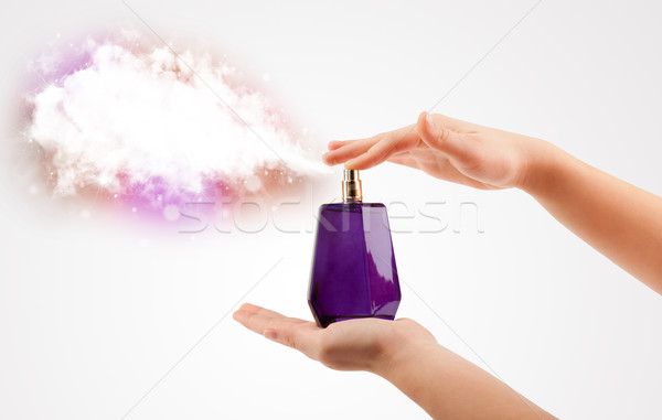 woman hands spraying colorful cloud Stock photo © ra2studio