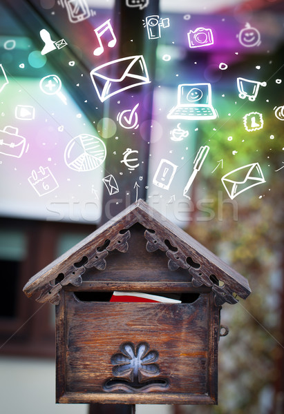 Colorful icons and symbols bursting out of a mailbox Stock photo © ra2studio