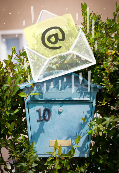 Envelope with email sign dropping into mailbox Stock photo © ra2studio