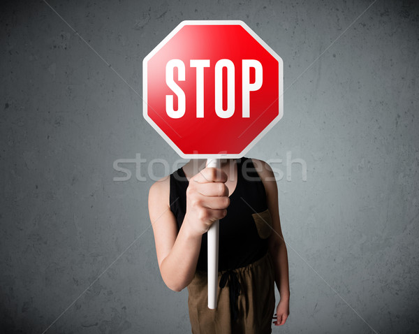 Fiatal nő tart stoptábla fiatal hölgy áll Stock fotó © ra2studio