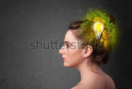 Young mind thinking of green eco energy with lightbulb Stock photo © ra2studio