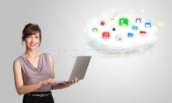 Young woman presenting cloud with colorful app icons and symbols Stock photo © ra2studio