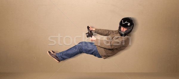 Happy funny man driving a flying car concept Stock photo © ra2studio