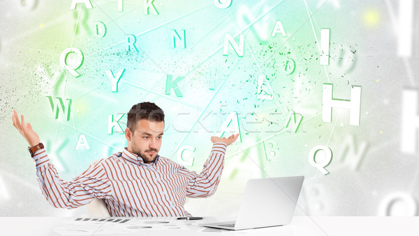 Stock photo: Business man at desk with green word cloud