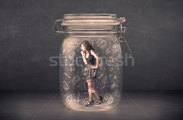 Business woman captured in glass jar with hand drawn media icons Stock photo © ra2studio