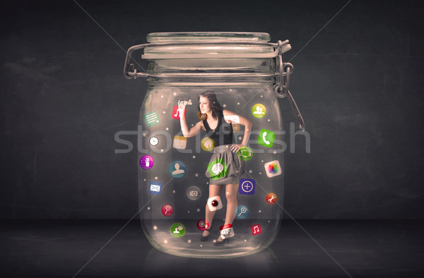 Businesswoman captured in a glass jar with colourful app icons c Stock photo © ra2studio