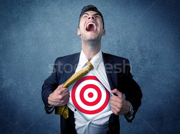 Businessman tearing shirt with target sign on his chest Stock photo © ra2studio