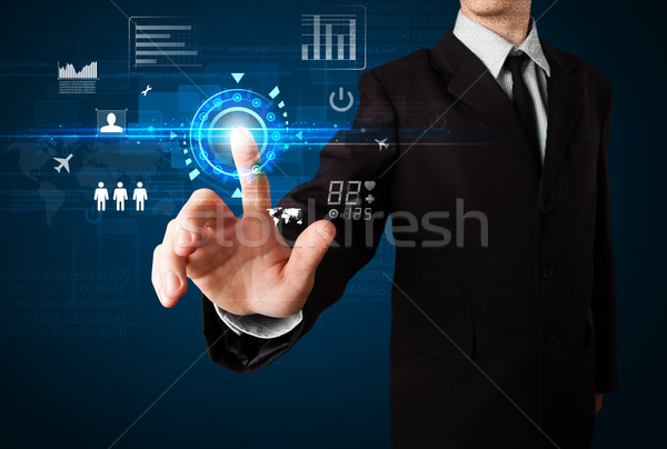 Handsome businessman touching future web technology buttons and  Stock photo © ra2studio