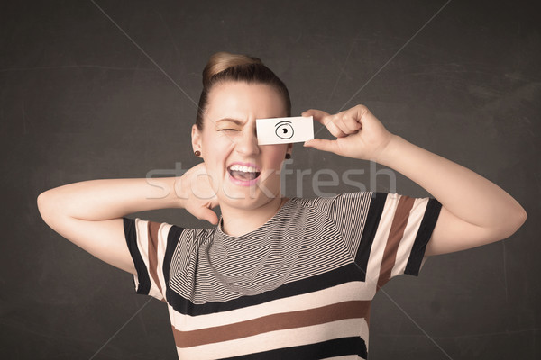 Funny woman looking with hand drawn paper eyes Stock photo © ra2studio