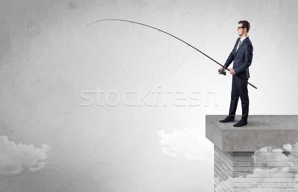 Businessman fishing nothing from the top Stock photo © ra2studio