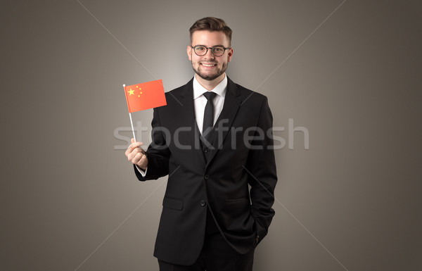 Handsome student standing with national flag Stock photo © ra2studio