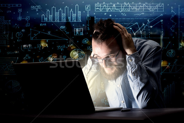 Businessman in the office at night Stock photo © ra2studio