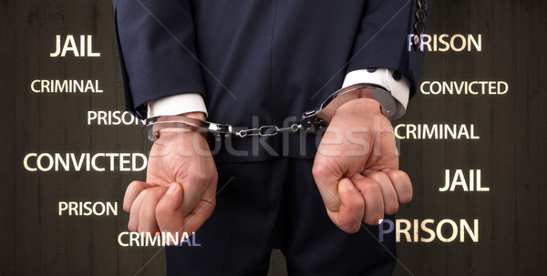 Close convicted with labels and handcuffs Stock photo © ra2studio