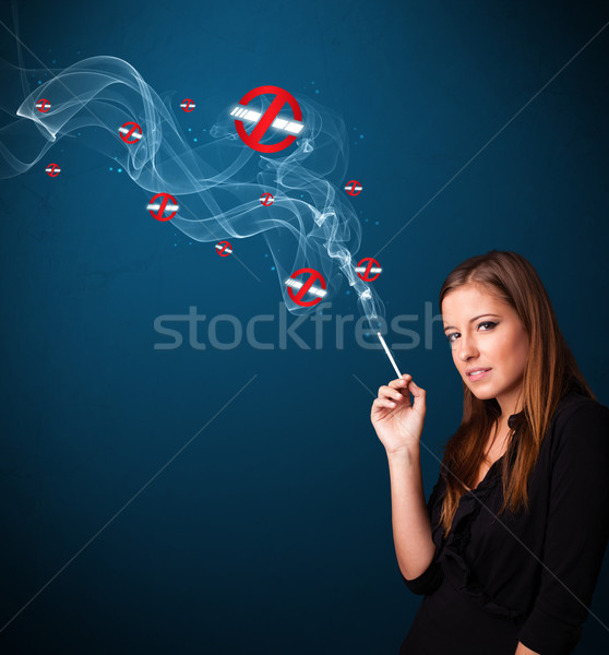 Young woman smoking dangerous cigarette with no smoking signs Stock photo © ra2studio