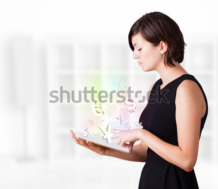Mulher jovem olhando moderno comprimido moeda ícones Foto stock © ra2studio