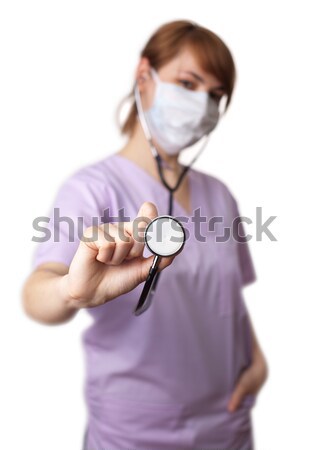 Female doctor holding stethoscope pointed toward camera 4. Stock photo © ra2studio