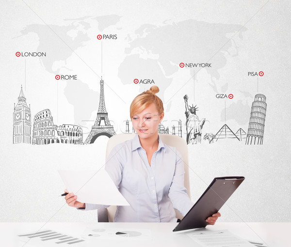 Beautiful young businesswoman with world map and major landmarks of the world Stock photo © ra2studio