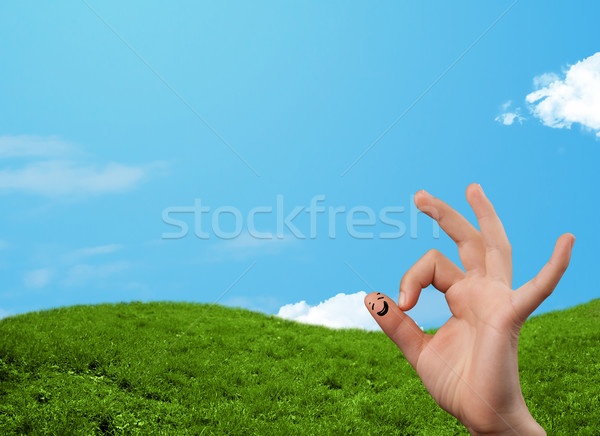 Cheerful happy smiling fingers with landscape scenery at the background Stock photo © ra2studio