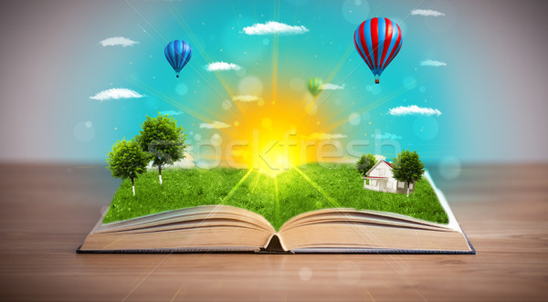 Open book with green nature world coming out of its pages Stock photo © ra2studio