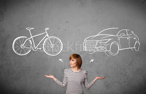 Woman making a choice between bicycle and car Stock photo © ra2studio