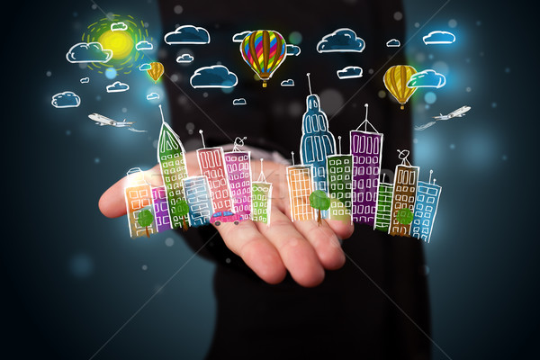 Young businessman presenting colorful hand drawn metropolitan ci Stock photo © ra2studio