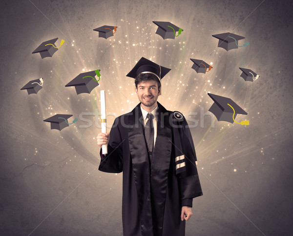 College graduate with many flying hats Stock photo © ra2studio