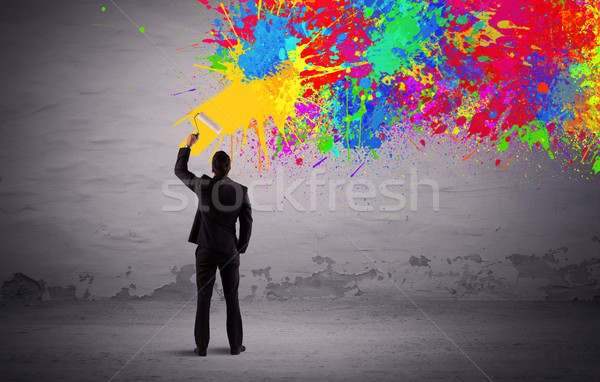 Sales person painting colorful splatter Stock photo © ra2studio