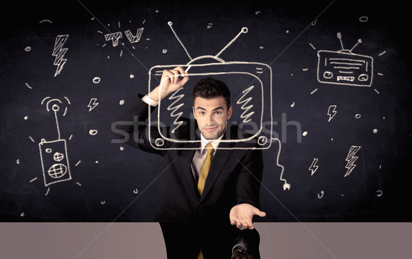 Happy businessman drawing tv and radio Stock photo © ra2studio