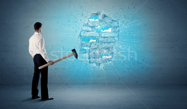 Business man hitting brick wall with huge hammer Stock photo © ra2studio