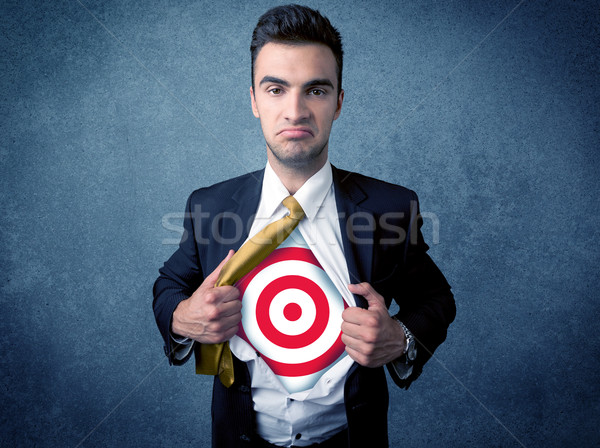 Businessman tearing shirt with target sign on his chest Stock photo © ra2studio