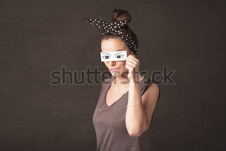 Young silly girl looking with hand drawn eye balls on paper Stock photo © ra2studio