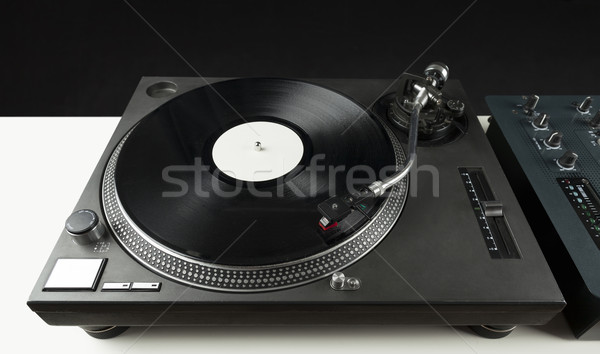 Stock photo: Turntable playing vinyl close up with needle on the record 
