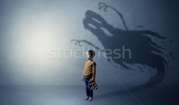 Scary ghost shadow behind kid Stock photo © ra2studio