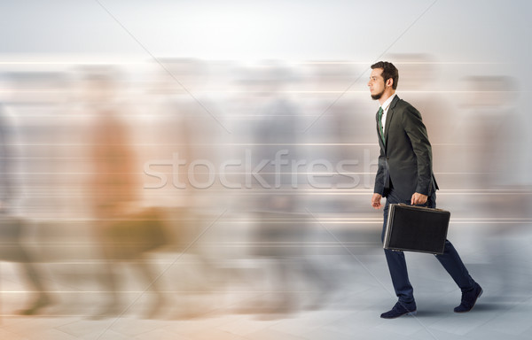 üzletember sétál zsúfolt utca fiatal aktatáska Stock fotó © ra2studio