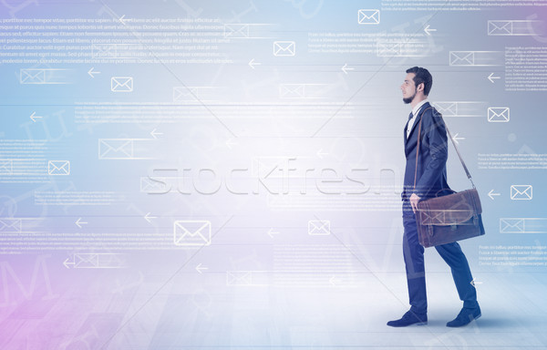 Businessman walking with mail concept around Stock photo © ra2studio