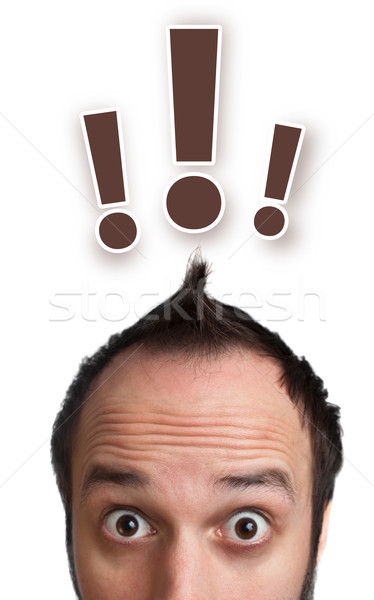 Funny young man with light  bulb over his head Stock photo © ra2studio